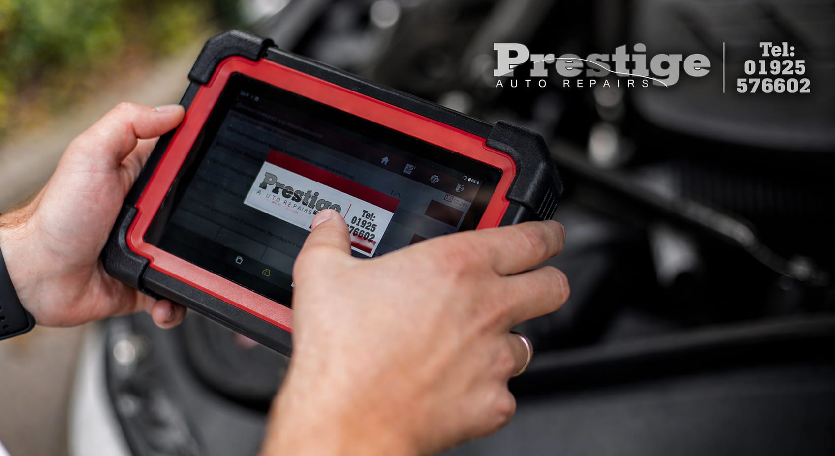 Prestige Auto Repairs vehicle diagnostics using professional diagnostic tablet